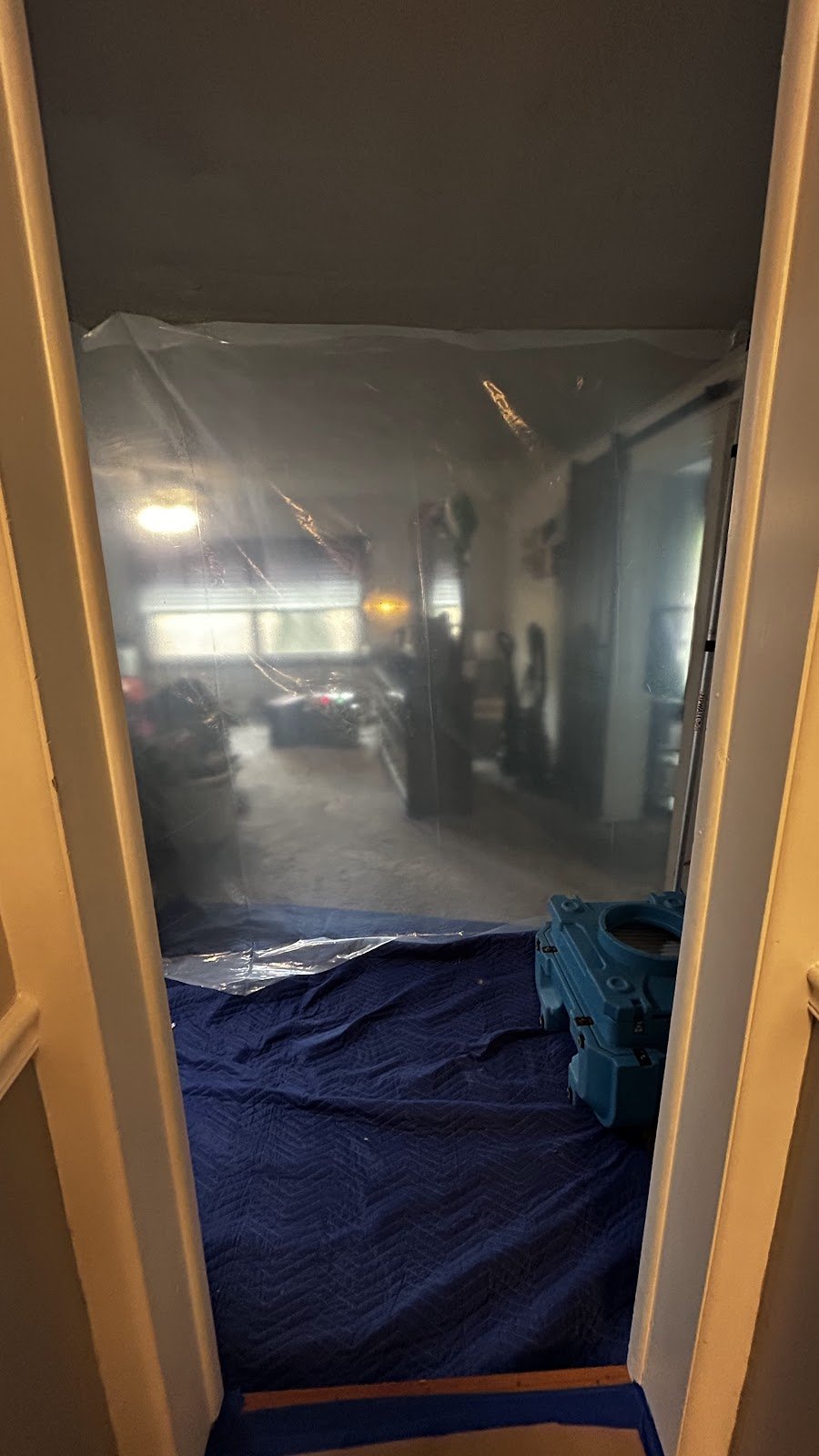 Protective sheeting and floor covering at an interior doorway